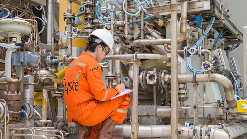 Systel specialist recording readings at a compressor station